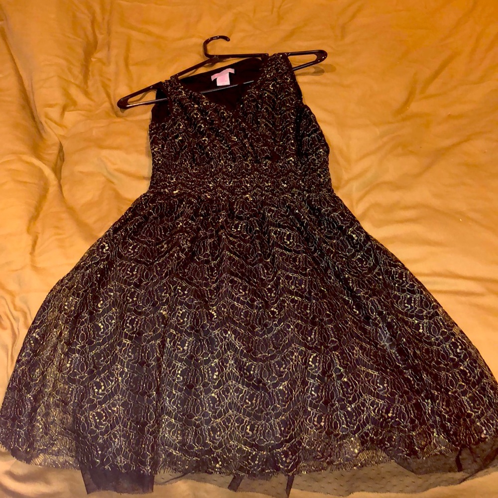 black dress with gold accents